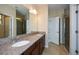 Bathroom boasts double vanity and granite countertop at 418 Laurel Spring Ct, Canton, GA 30114