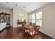 Spacious dining room featuring hardwood floors and elegant furnishings at 418 Laurel Spring Ct, Canton, GA 30114