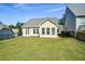 Spacious backyard with grassy area and home exterior at 418 Laurel Spring Ct, Canton, GA 30114