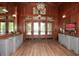 Elegant lobby with hardwood floors and a large TV at 418 Laurel Spring Ct, Canton, GA 30114