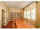 Relaxing library with large table and bookshelves at 418 Laurel Spring Ct, Canton, GA 30114