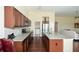 Open concept kitchen featuring granite countertops and hardwood floors at 418 Laurel Spring Ct, Canton, GA 30114