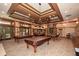 Game room with multiple pool tables and comfortable seating at 418 Laurel Spring Ct, Canton, GA 30114