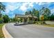 Gated entrance to the community with guard house at 418 Laurel Spring Ct, Canton, GA 30114