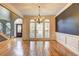 Bright dining room with hardwood floors, large windows, and a chandelier at 776 Hayes Ct, College Park, GA 30349