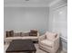 Living room with hardwood floors, neutral walls, and comfy seating at 2700 Pine Tree Ne Rd # 2108, Atlanta, GA 30324