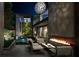 Outdoor patio with fire pit and seating area at night at 748 Charles Allen Dr, Atlanta, GA 30308
