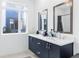 Modern bathroom with double vanity and dark cabinetry at 395 Pratt Drive Se, Unit #802, Atlanta, GA 30315