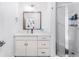 Modern bathroom with white vanity, shower, and herringbone tile at 395 Pratt Drive Se, Unit #802, Atlanta, GA 30315