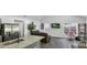 Spacious living room with dark leather couch and large windows, offering plenty of natural light at 287 Church St, Dacula, GA 30019