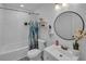 Clean bathroom with a tub, shower, and modern vanity at 287 Church St, Dacula, GA 30019