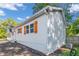 Rear view of a white house with clean lines and modern design, showcasing its exterior features at 287 Church St, Dacula, GA 30019