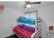 Cozy bedroom with a bunk bed, window, and ceiling fan at 287 Church St, Dacula, GA 30019