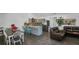 Open concept dining area with farmhouse table and chairs, adjacent to the kitchen at 287 Church St, Dacula, GA 30019