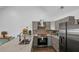 Modern kitchen with stainless steel appliances, granite countertops, and stylish cabinetry at 287 Church St, Dacula, GA 30019