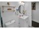 Simple bathroom with a toilet, sink and large mirror at 287 Church St, Dacula, GA 30019