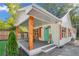 White house with a large front porch, showcasing its stylish design and curb appeal at 287 Church St, Dacula, GA 30019