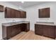 Modern kitchen with dark brown cabinets and granite countertops at 5361 N Main St, Acworth, GA 30101