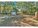 Large backyard with mature trees and a shed at 5361 N Main St, Acworth, GA 30101