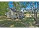 White house with a covered porch at 5361 N Main St, Acworth, GA 30101