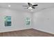 Spacious bedroom with hardwood floors and two large windows at 5361 N Main St, Acworth, GA 30101