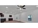 Bright living room with ceiling fan, recessed lighting, and hardwood floors at 5361 N Main St, Acworth, GA 30101