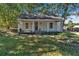 Quaint white house with front porch at 5361 N Main St, Acworth, GA 30101
