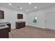 Modern kitchen featuring dark brown cabinets and granite countertops at 5361 N Main St, Acworth, GA 30101