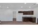 Modern kitchen with dark brown cabinets and granite countertops at 5361 N Main St, Acworth, GA 30101