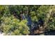 Aerial view showing house nestled among trees at 5361 N Main St, Acworth, GA 30101
