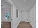 Clean hallway with doors to bedrooms and other rooms at 5361 N Main St, Acworth, GA 30101