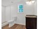 Modern bathroom with marble shower and granite vanity at 5361 N Main St, Acworth, GA 30101