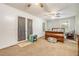 Main bedroom with a ceiling fan and french doors leading outside at 1736 Pleasant Grove Rd, Temple, GA 30179
