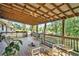 Spacious deck with wooden flooring and wicker furniture at 1736 Pleasant Grove Rd, Temple, GA 30179