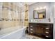 Clean bathroom with a dark brown vanity and tile shower surround at 1736 Pleasant Grove Rd, Temple, GA 30179