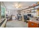 Spacious home office with built-in shelving and hardwood floors at 1736 Pleasant Grove Rd, Temple, GA 30179