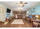 Spacious living room with a brick fireplace and hardwood floors at 1736 Pleasant Grove Rd, Temple, GA 30179