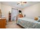 Bedroom with a ceiling fan and wood dresser at 1736 Pleasant Grove Rd, Temple, GA 30179