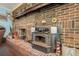 Brick fireplace with wood burning stove and decorative mantle at 1736 Pleasant Grove Rd, Temple, GA 30179