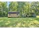 Two storage sheds in a large grassy backyard at 1736 Pleasant Grove Rd, Temple, GA 30179