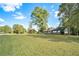 Ranch house with large yard, mature trees, and a brick facade at 1736 Pleasant Grove Rd, Temple, GA 30179