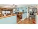Open living room with hardwood floors, a half wall, and access to an office at 1736 Pleasant Grove Rd, Temple, GA 30179