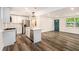 Modern kitchen with white cabinets, island, stainless steel appliances, and quartz countertops at 408 Belgarde Place Se, Atlanta, GA 30354