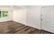 Bright living room featuring hardwood floors and a view of the backyard at 408 Belgarde Place Se, Atlanta, GA 30354