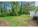 Spacious backyard with mature trees and a shed at 408 Belgarde Place Se, Atlanta, GA 30354