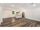 Open concept living space with kitchen views and wood-look vinyl flooring at 408 Belgarde Place Se, Atlanta, GA 30354