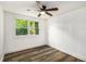 Bright bedroom with wood-look vinyl flooring and a ceiling fan at 408 Belgarde Place Se, Atlanta, GA 30354