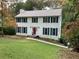 Two-story house with white siding and green shutters at 26 Flint Ridge Se Dr, Mableton, GA 30126