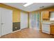 Kitchen dining area with wood flooring and access to the backyard at 3127 Fields Dr, Lithonia, GA 30038