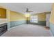 Living room with fireplace, carpet, and ceiling fan at 3127 Fields Dr, Lithonia, GA 30038